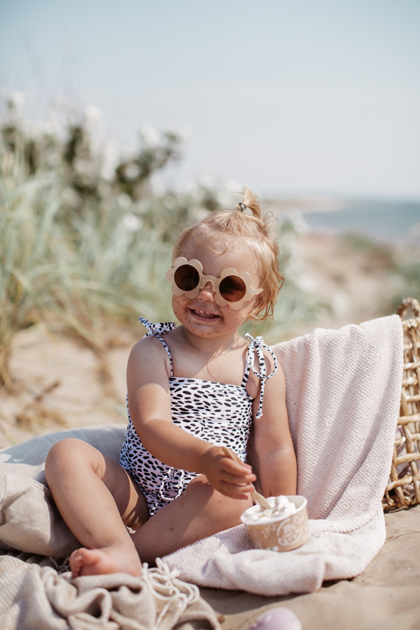 Our RUE swimsuit features thin adjustable tying shoulder strap to provide room for the perfect fit and growth.